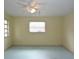 Standard bedroom with one window, ceiling fan and neutral colored walls at 8568 Heather Blvd, Weeki Wachee, FL 34613