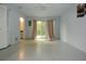 Spacious bedroom with sliding glass doors and ample natural light at 8568 Heather Blvd, Weeki Wachee, FL 34613