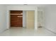 Bedroom featuring a wood accent wall and white walls at 8568 Heather Blvd, Weeki Wachee, FL 34613