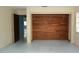 Bedroom featuring a wood accent wall and neutral colored walls at 8568 Heather Blvd, Weeki Wachee, FL 34613