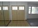 Spacious entryway featuring a tiled floor, double doors and a nearby window at 8568 Heather Blvd, Weeki Wachee, FL 34613