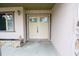 Inviting front entryway with a double door design and a sidelight window at 8568 Heather Blvd, Weeki Wachee, FL 34613