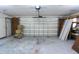 View of garage and garage door with plenty of space for parking and storage at 8568 Heather Blvd, Weeki Wachee, FL 34613