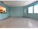 Open living area with kitchen views and large windows for plenty of light at 8568 Heather Blvd, Weeki Wachee, FL 34613