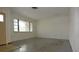 Large living room with neutral walls and tile floors at 8568 Heather Blvd, Weeki Wachee, FL 34613