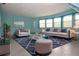 Comfortable living room featuring plush seating, a modern rug, and ample natural light at 8568 Heather Blvd, Weeki Wachee, FL 34613