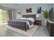 Spacious bedroom featuring a large bed, modern decor, and natural light at 8568 Heather Blvd, Weeki Wachee, FL 34613