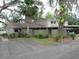 Inviting single-story home featuring a covered carport and well-maintained landscaping at 8640 Lake Isle Dr # 188, Temple Terrace, FL 33637