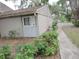 Well-maintained side yard showing partial view of unit at 8640 Lake Isle Dr # 188, Temple Terrace, FL 33637
