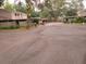 Community parking area featuring covered carports and mature landscaping at 8640 Lake Isle Dr # 188, Temple Terrace, FL 33637