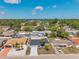 An aerial view showcases the well-maintained homes in the neighborhood with mature landscaping and inviting curb appeal at 9005 Lido Ln, Port Richey, FL 34668