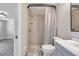 Modern bathroom features tiled shower, updated vanity, and neutral color palette, creating a calming atmosphere at 9005 Lido Ln, Port Richey, FL 34668
