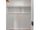 A closet featuring a shelf and clothing rod providing organized storage solutions at 9005 Lido Ln, Port Richey, FL 34668