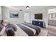 Tastefully decorated main bedroom with ensuite bathroom, wood-look flooring, and ample closet space at 9005 Lido Ln, Port Richey, FL 34668