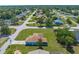Aerial view showcases the property's generous lot, mature landscaping, and its location in a residential area at 9251 Geneva St, Spring Hill, FL 34608