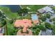 Aerial view of property and community pool, showcasing the well-maintained landscape at 9933 Milano Dr, Trinity, FL 34655