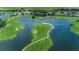 Picturesque aerial view of a golf course community with lakes and lush landscaping at 9933 Milano Dr, Trinity, FL 34655