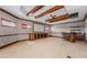 Entertaining basement with projector screen, bar area, and wood beam ceiling at 9933 Milano Dr, Trinity, FL 34655