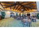 Clubhouse interior with vaulted ceilings, wooden beams, elegant chandeliers, and seating arrangements at 9933 Milano Dr, Trinity, FL 34655