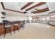 Entertainment room features a bar, projector screen, with wood trim, carpet and plenty of space at 9933 Milano Dr, Trinity, FL 34655
