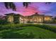 Stunning home features a manicured lawn, stone accents, and a three-car garage at 9933 Milano Dr, Trinity, FL 34655