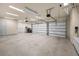 Spacious three-car garage with high ceilings and ample storage space at 9933 Milano Dr, Trinity, FL 34655