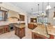 Large open kitchen with an island, stainless appliances, and granite countertops at 9933 Milano Dr, Trinity, FL 34655