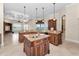 Gourmet kitchen with a large island, granite countertops, and stainless steel appliances at 9933 Milano Dr, Trinity, FL 34655