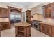 Gourmet kitchen featuring granite counters, stainless appliances, and custom cabinetry at 9933 Milano Dr, Trinity, FL 34655