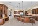 Gourmet kitchen with granite counters and a center island with seating at 9933 Milano Dr, Trinity, FL 34655