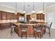 Spacious kitchen with custom island, granite countertops, and stainless steel appliances at 9933 Milano Dr, Trinity, FL 34655