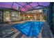 Gorgeous outdoor living space with a large pool and spa area at 9933 Milano Dr, Trinity, FL 34655