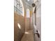Custom tiled walk-in shower featuring arched windows and modern fixtures at 9933 Milano Dr, Trinity, FL 34655