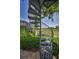 Outdoor spiral staircase leading up to the pool area and golf course view at 9933 Milano Dr, Trinity, FL 34655