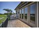 Outdoor terrace with golf course views and screened-in lanai at 9933 Milano Dr, Trinity, FL 34655