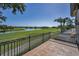 Scenic terrace view of the golf course and serene lake at 9933 Milano Dr, Trinity, FL 34655