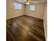 Bedroom features modern flooring and natural lighting at 10014 Kingswood Ln, Port Richey, FL 34668