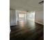 Spacious living room with new flooring and a ceiling fan at 10014 Kingswood Ln, Port Richey, FL 34668