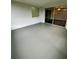 This patio area offers a smooth painted floor with access via sliding glass doors and a brick window at 10014 Kingswood Ln, Port Richey, FL 34668