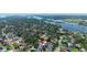 Waterfront community aerial view featuring waterways surrounded by homes with mature trees at 1004 Peninsula Ave, Tarpon Springs, FL 34689