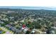The house is surrounded by mature trees in a well-established neighborhood near the bay at 1004 Peninsula Ave, Tarpon Springs, FL 34689