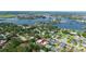 Neighborhood near a body of water with a waterfront view and homes surrounded by lush greenery at 1004 Peninsula Ave, Tarpon Springs, FL 34689