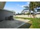 Backyard with concrete patio and lots of space for outdoor activities at 1004 Peninsula Ave, Tarpon Springs, FL 34689