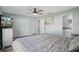 Spacious bedroom with a ceiling fan, closet, and ensuite bathroom at 1004 Peninsula Ave, Tarpon Springs, FL 34689