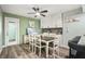 Dining area features modern lighting, stylish decor, and a view to the outdoor space at 1004 Peninsula Ave, Tarpon Springs, FL 34689