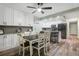 Bright dining area with white cabinets, pendant lighting, and a view into the kitchen at 1004 Peninsula Ave, Tarpon Springs, FL 34689
