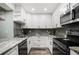Well-equipped kitchen featuring stainless steel appliances and modern finishes at 1004 Peninsula Ave, Tarpon Springs, FL 34689