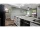 Spacious kitchen features a breakfast nook and granite counters at 1004 Peninsula Ave, Tarpon Springs, FL 34689