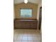 Bathroom featuring glass block window, long vanity with cabinets, and walk-in shower at 10054 Hernando Ridge Rd, Weeki Wachee, FL 34613