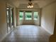 Cozy breakfast nook with tiled flooring, a bay window offering natural light, and views of the yard at 10054 Hernando Ridge Rd, Weeki Wachee, FL 34613